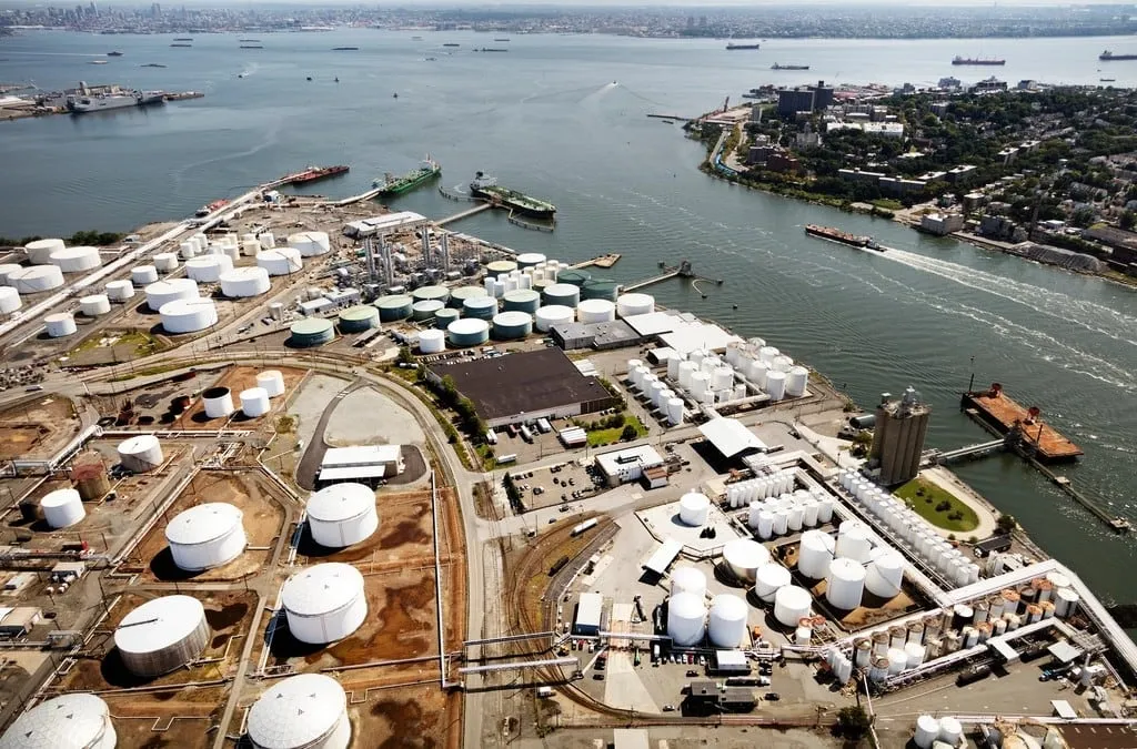 Aerial view of an industrial port with storage tanks